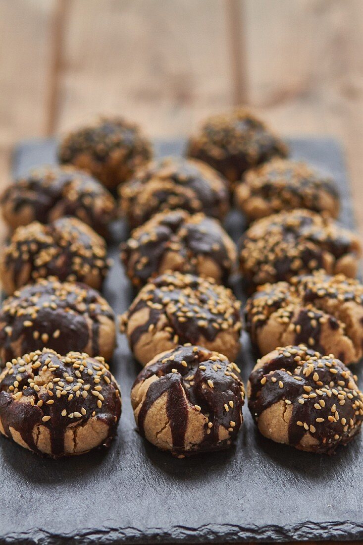 Polvorones (Spanish biscuits) with chocolate glaze and sesame seeds