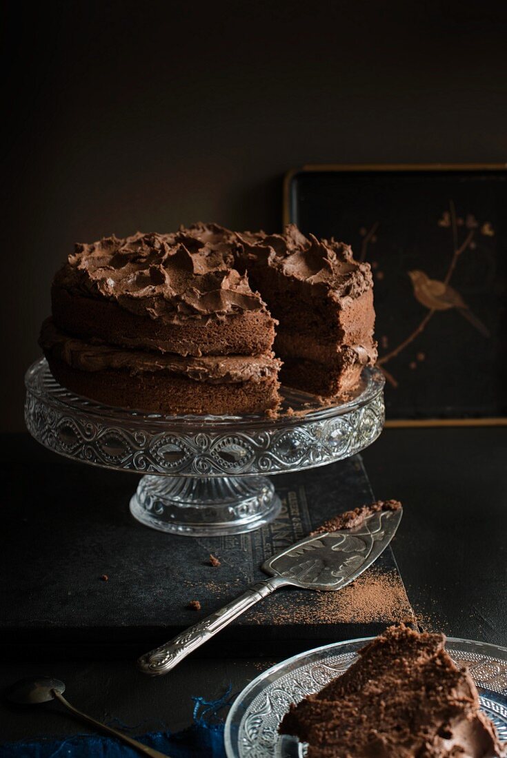 Chocolate cake on a cake stand (sliced)