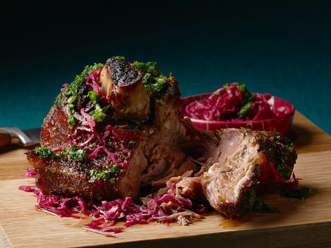 Slow roasted pork knuckle with kale escabeche and red cabbage
