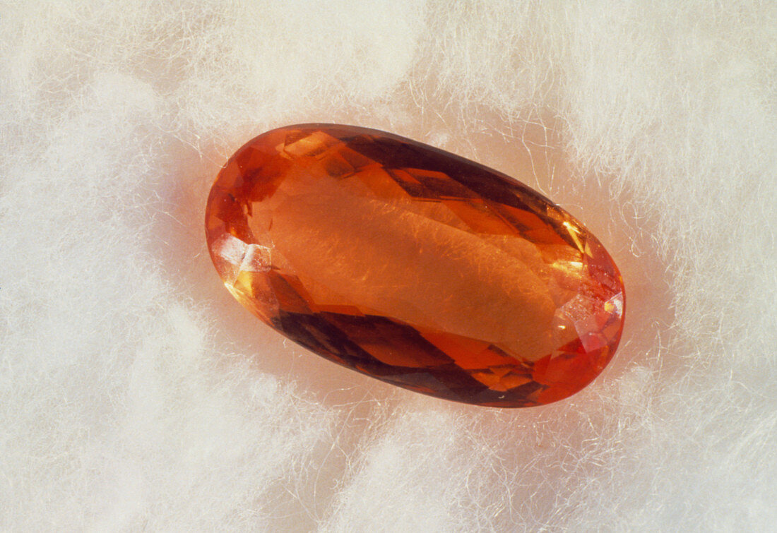 Cut and polished crystal of imperial topaz