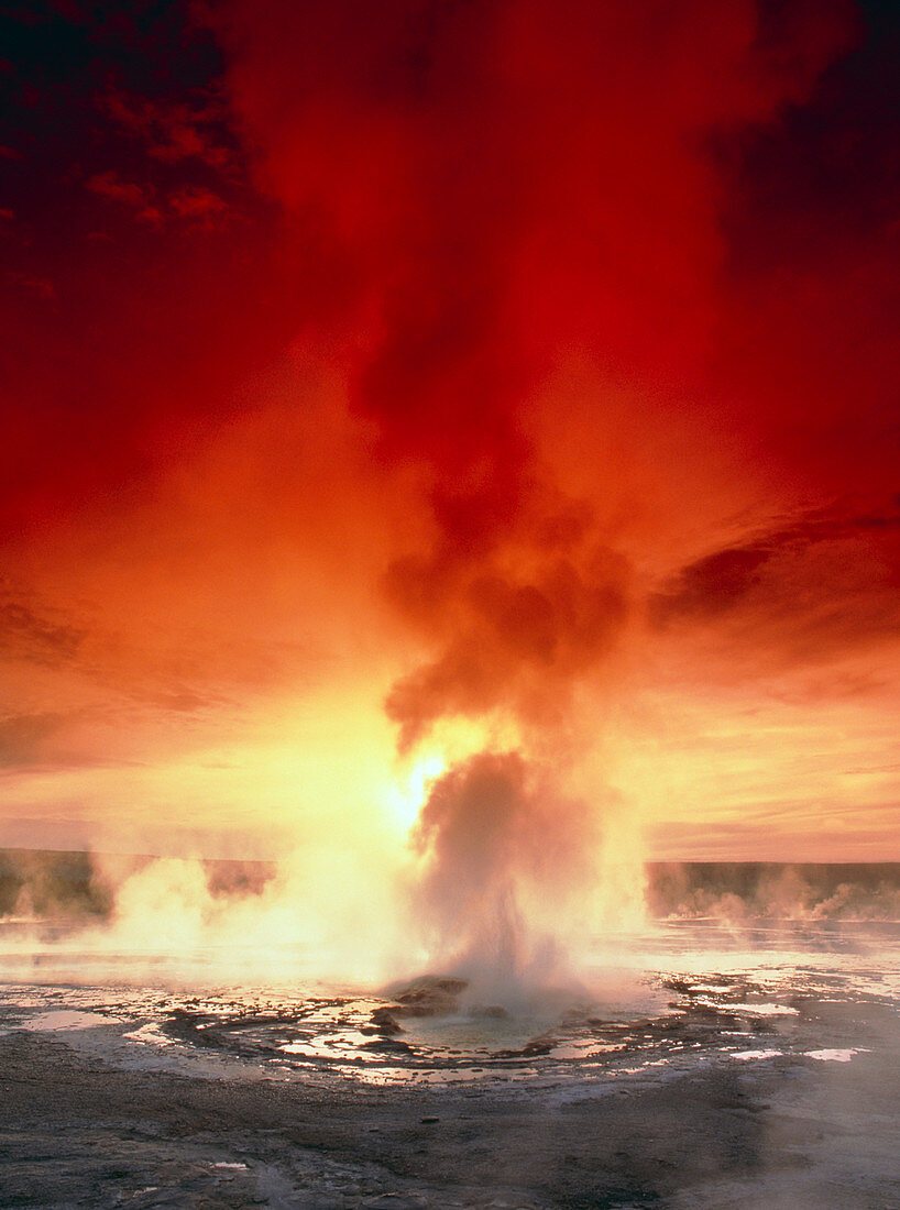 Geyser steaming at sunset,Yellowstone Park