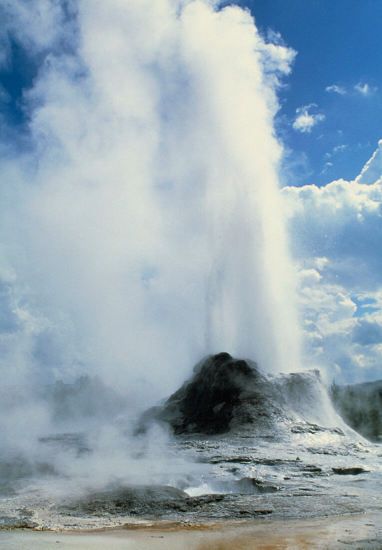 Water and steam erupting from a geyser