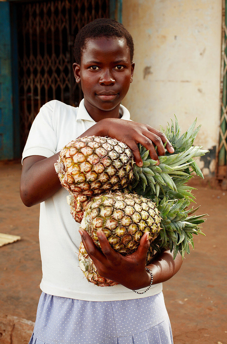 Woman with pineapples