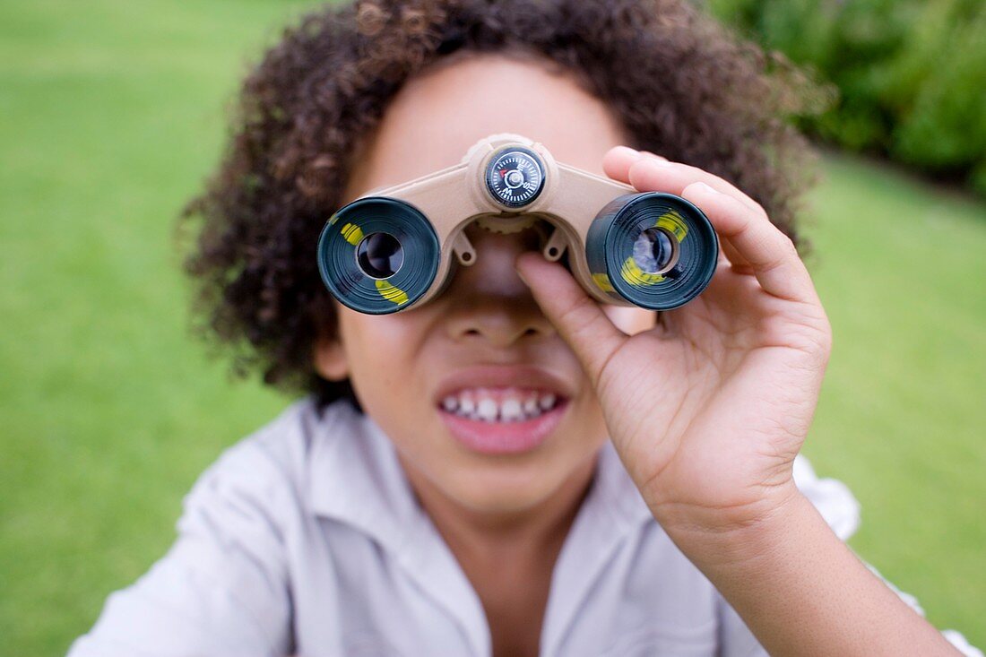 Boy using binoculars
