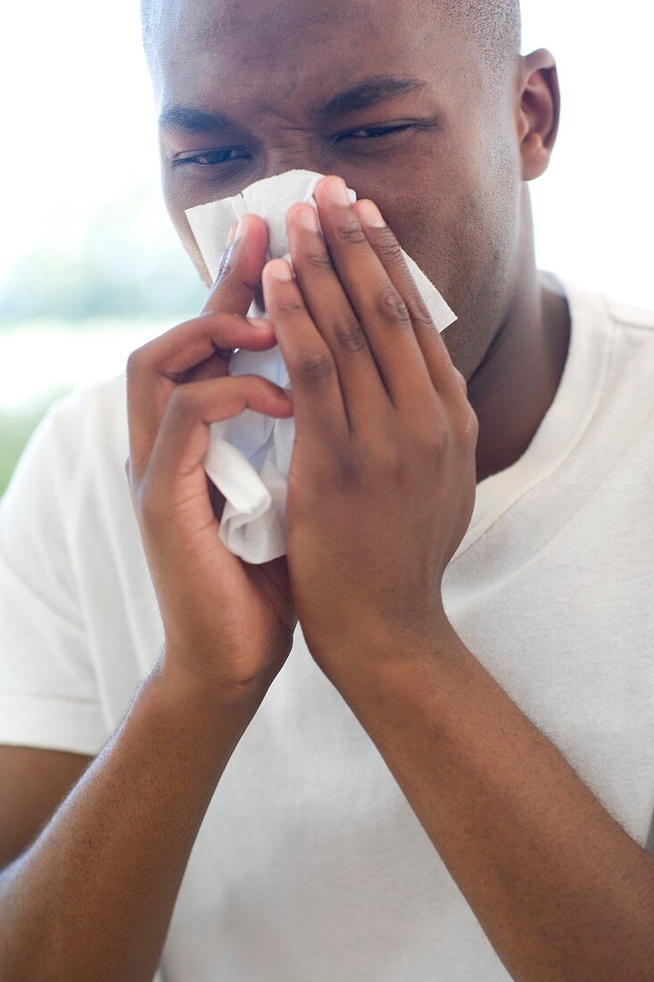 Man blowing his nose