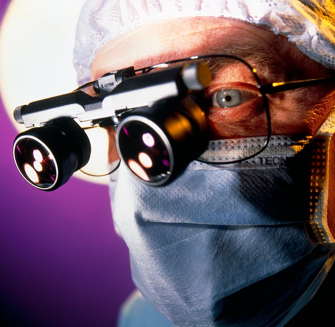 Surgeon with magnifying lenses for microsurgery