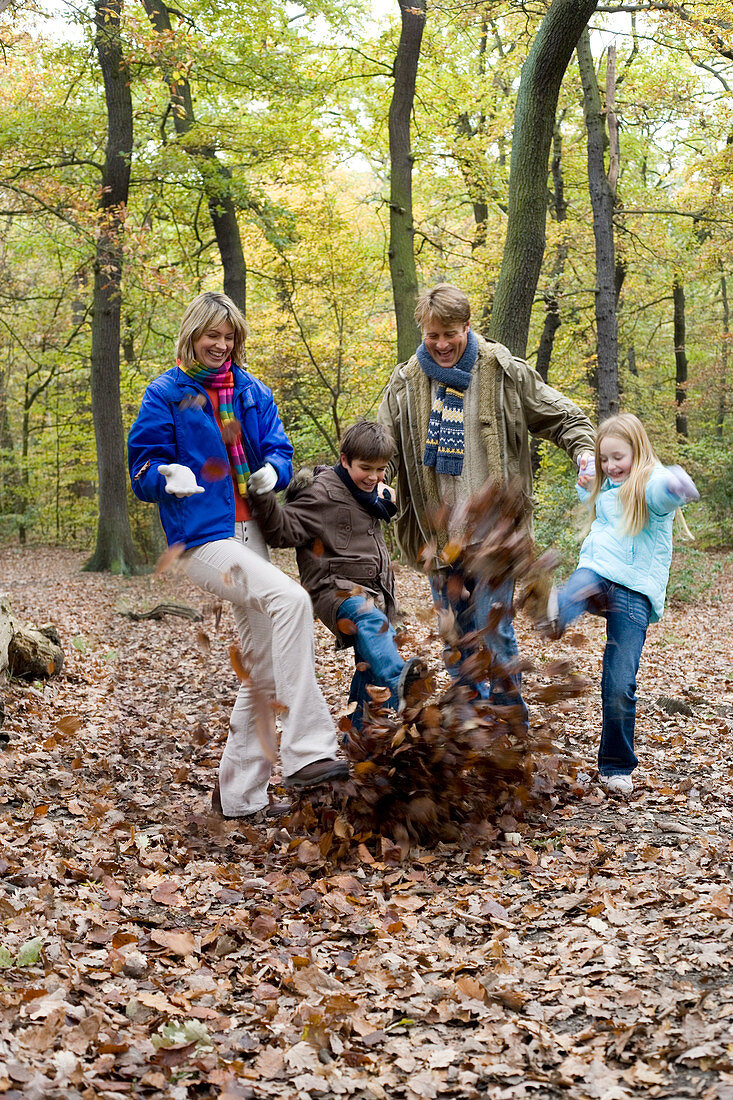Family playing in a wood