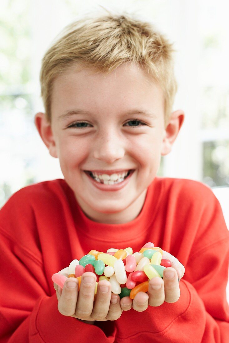 Boy holding sweets