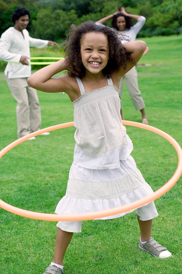 Girl playing with a hula hoop