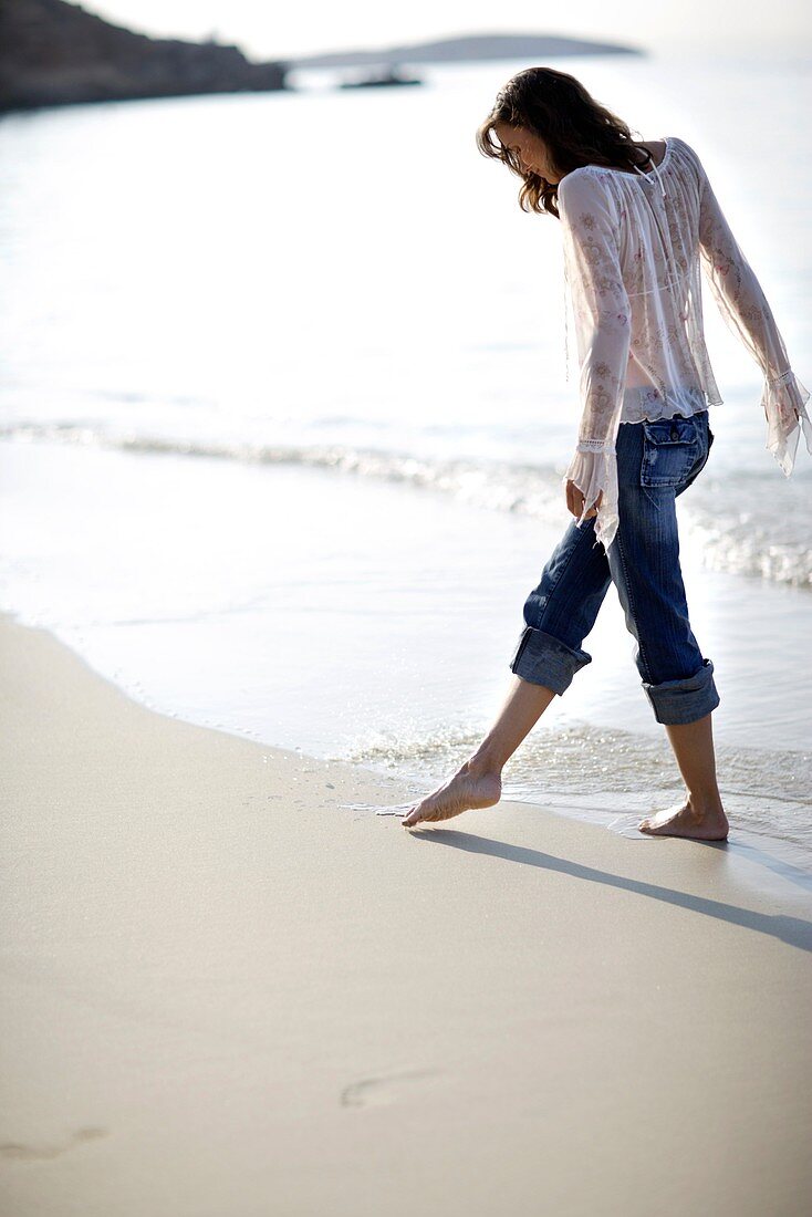 Woman walking along a beach