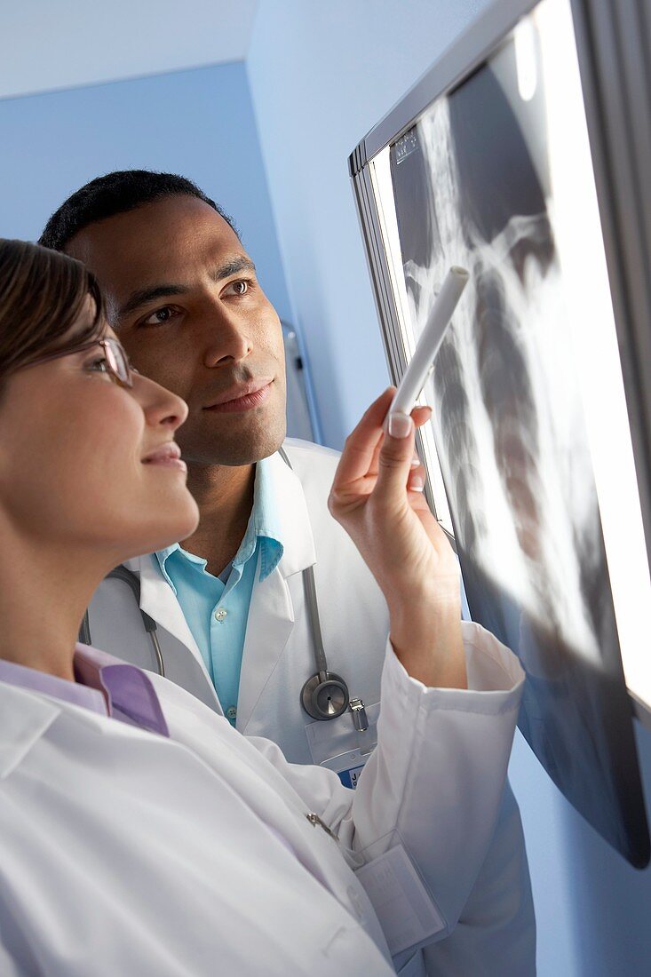 Radiologists examining an X-ray