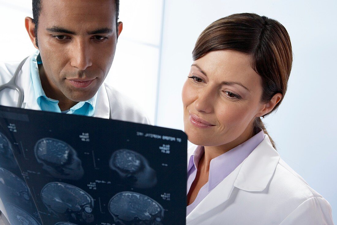 Doctors examining MRI scans