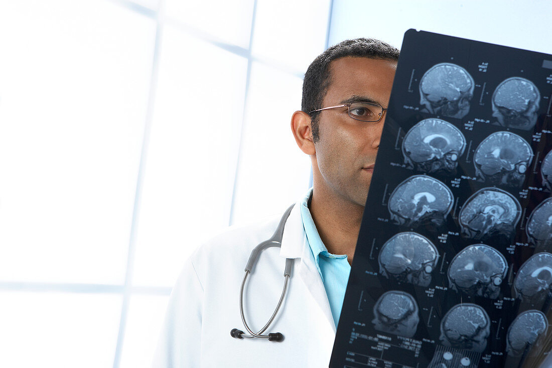 Doctor examining MRI scans