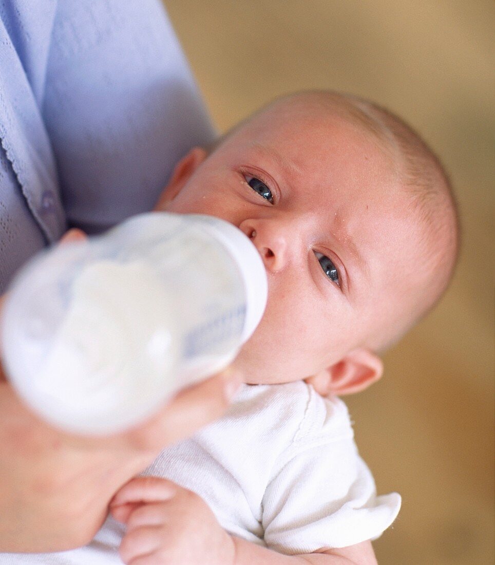 Bottle-feeding baby boy