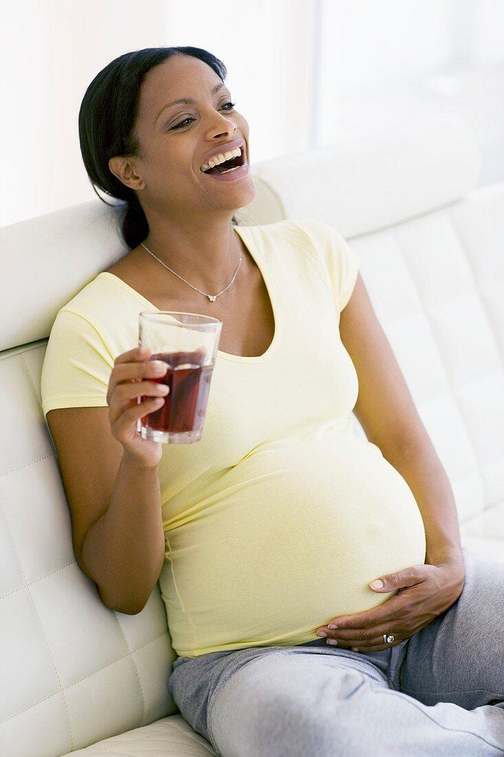 Pregnant woman laughing
