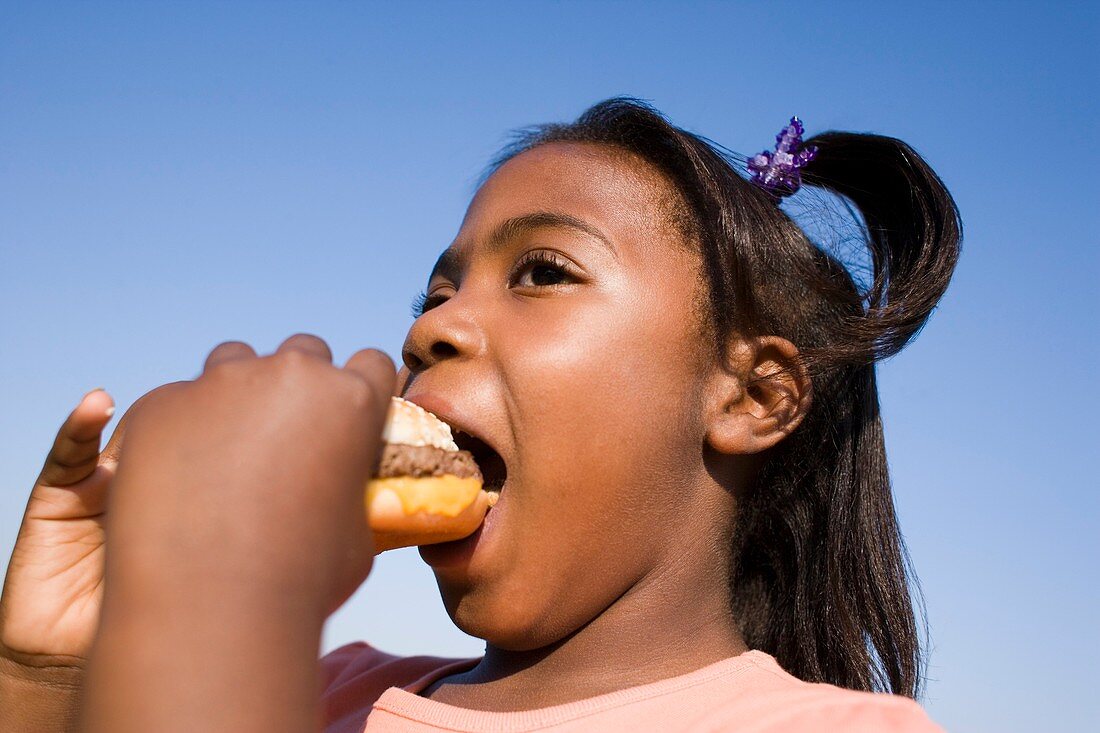 Girl eating a burger