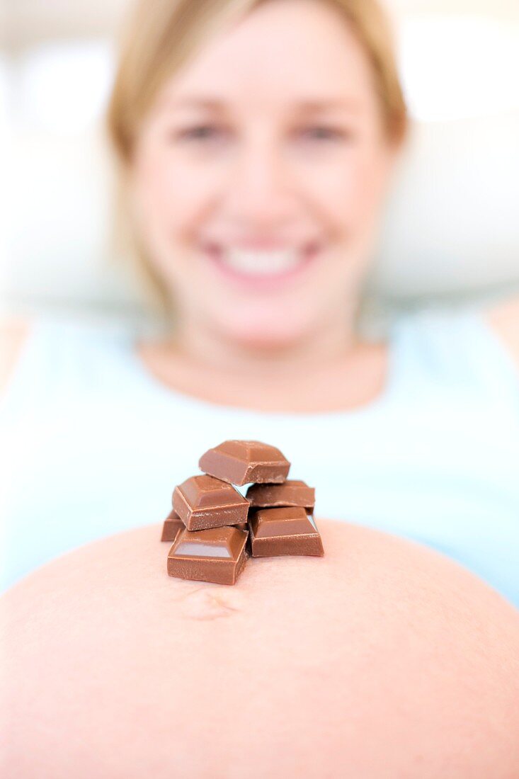 Chocolate on a pregnant woman's abdomen