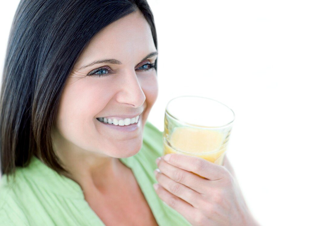 Woman drinking fruit juice