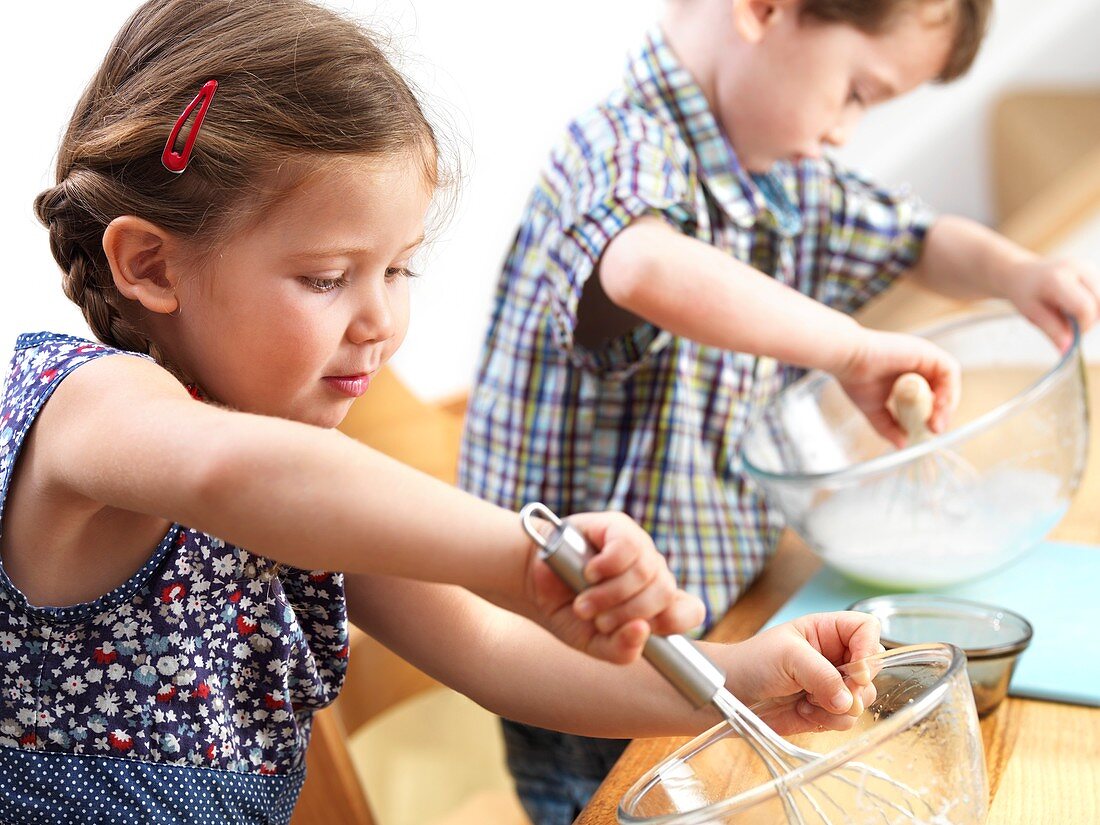 Young children baking