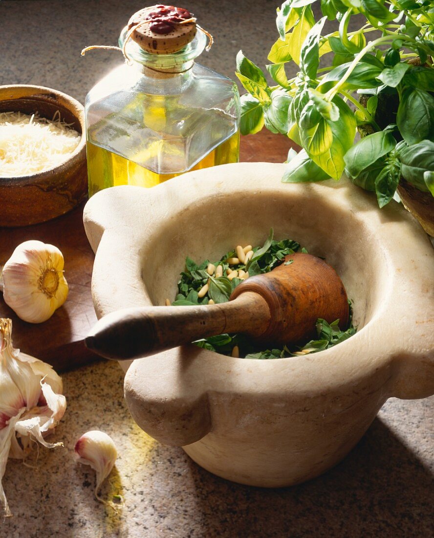 Preparing pesto in a mortar