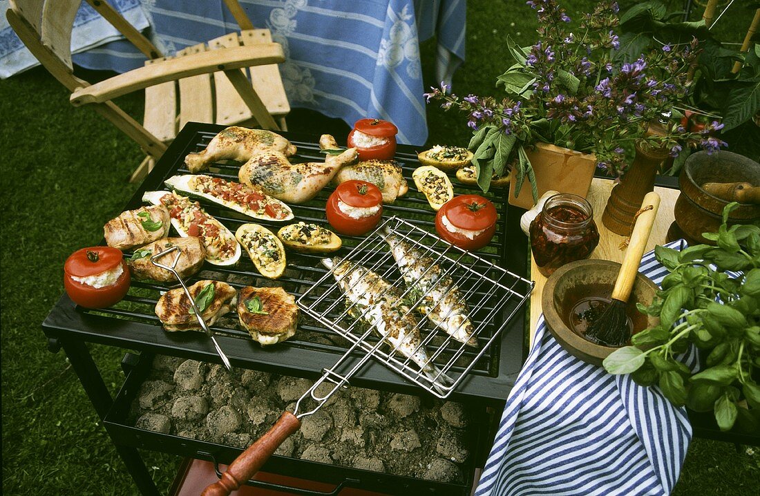 Stuffed vegetables, meat and fish on the grill