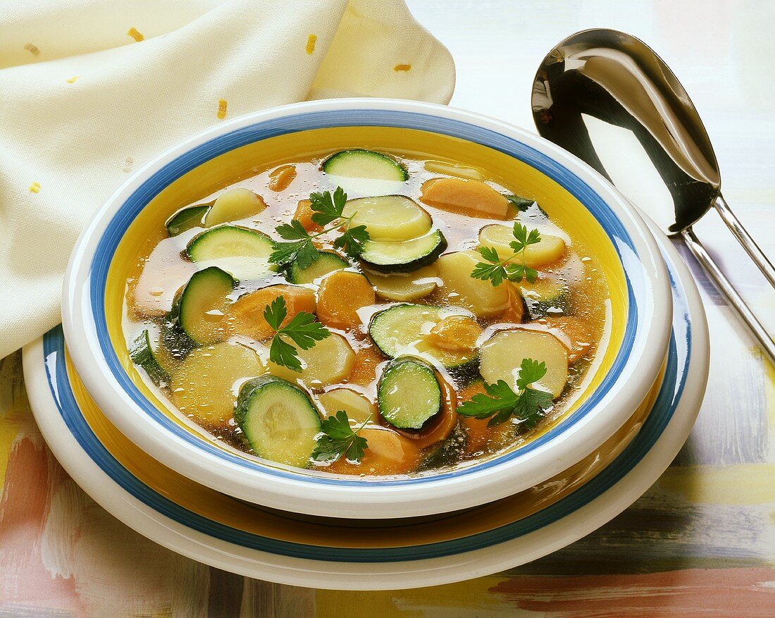 Vegetable broth with potatoes, courgettes and carrots