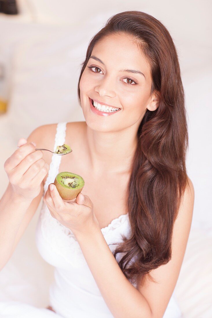 Woman eating fruit