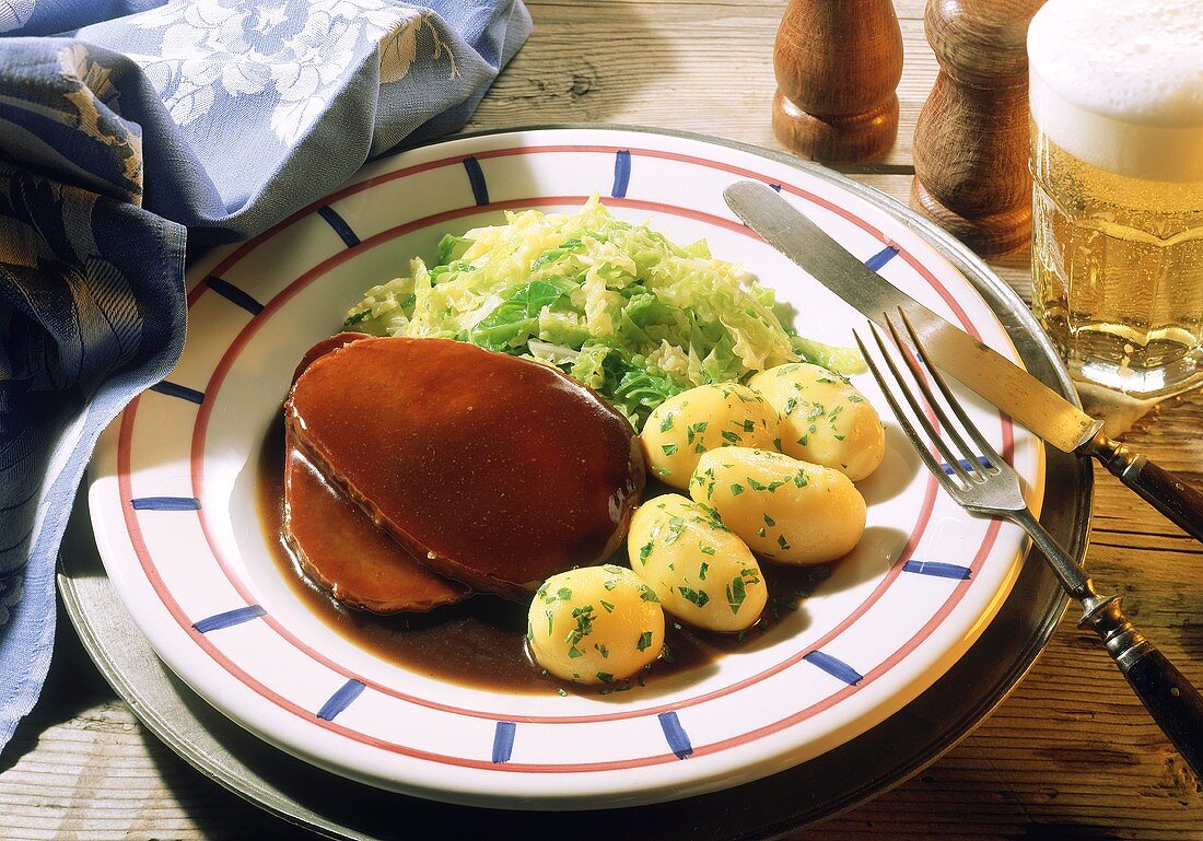 Braised pickled beef with new potatoes and savoy