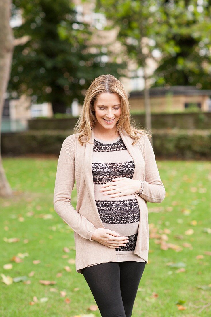 Pregnant woman in park