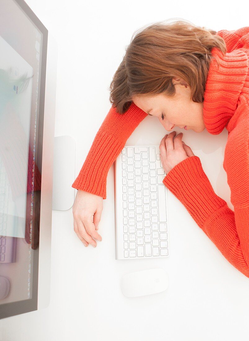 Woman asleep on keyboard