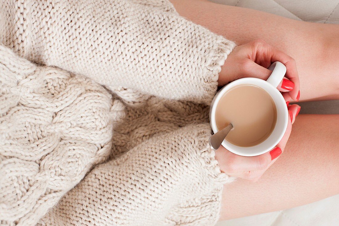 Woman holding coffee