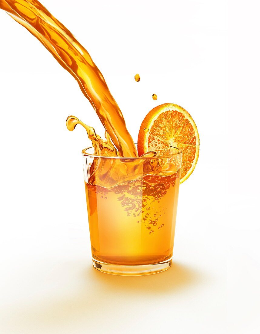 Orange juice being poured into a glass