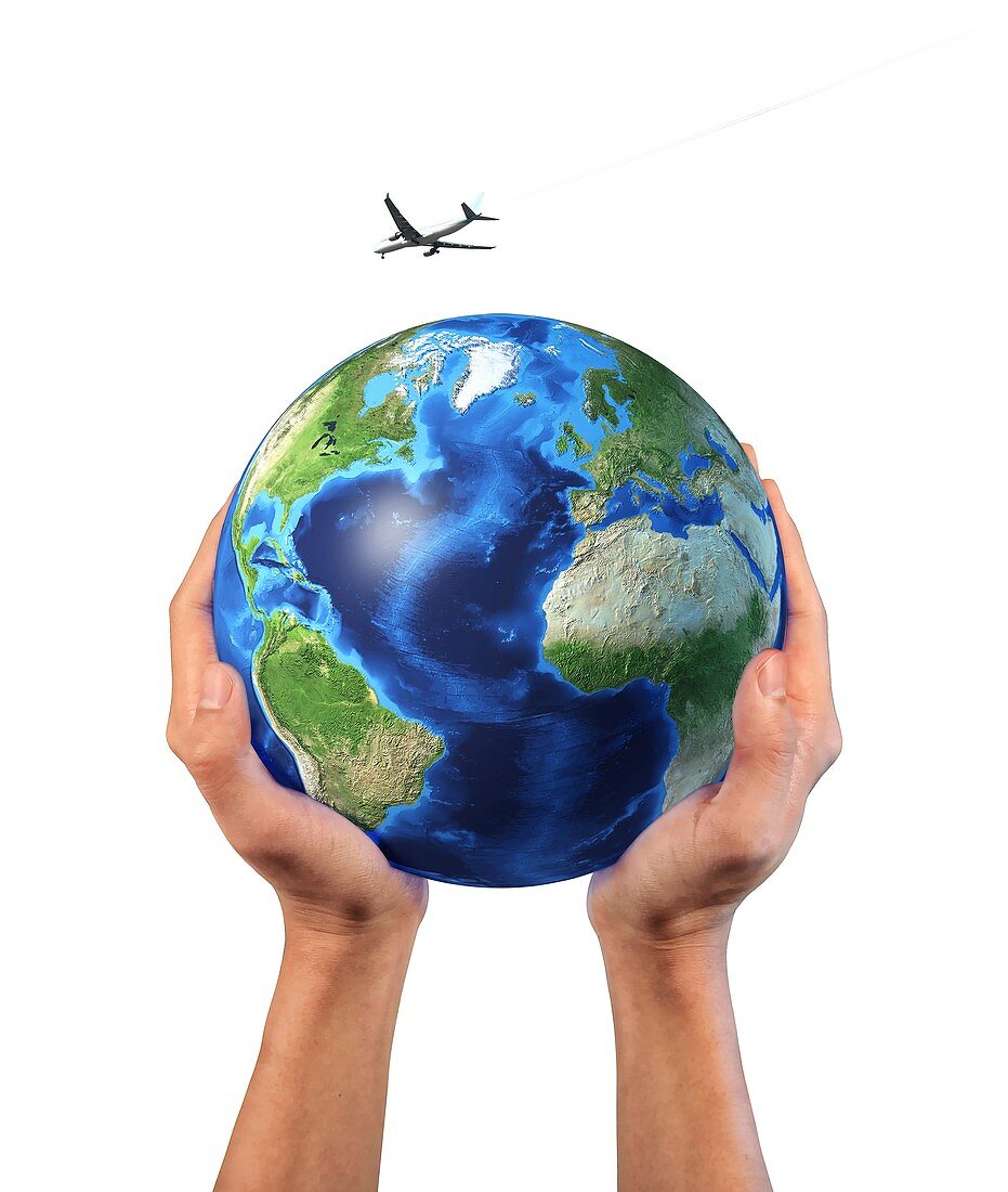 Hands holding globe with aeroplane