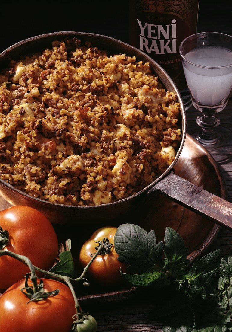 Turkish mince and bulgur dish with tomatoes and cheese