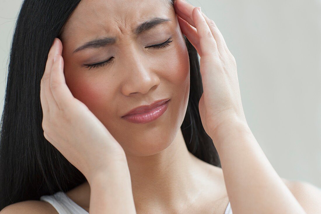 Woman touching head