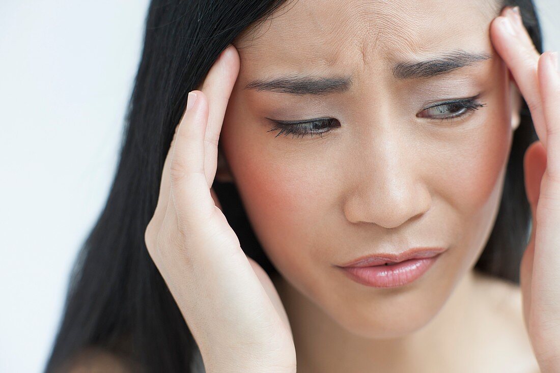 Woman touching head