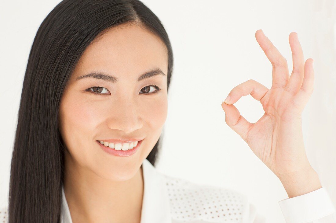 Woman making ok sign