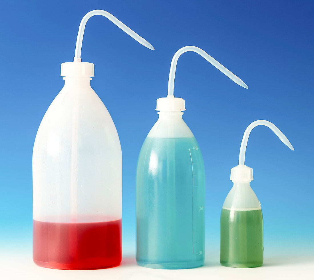 Colourful liquids in plastic bottles