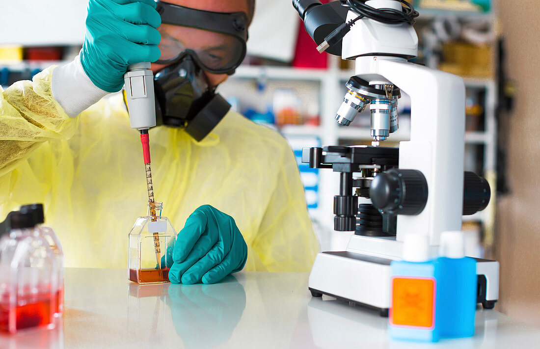 Scientist in hazmat suit