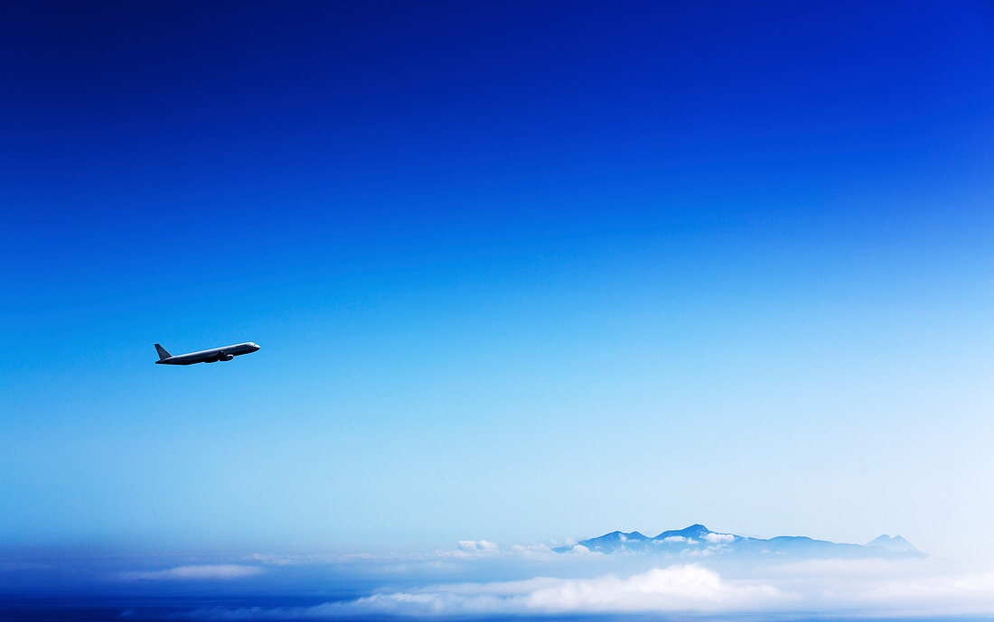 Aeroplane flying in a clear blue sky