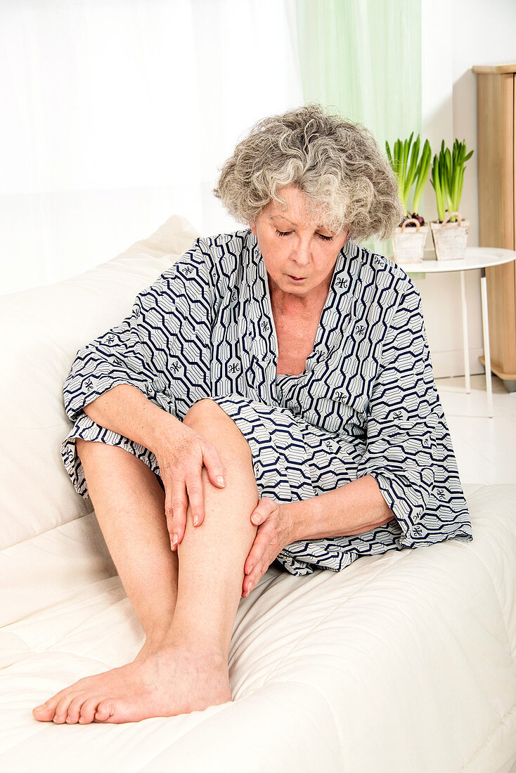 Woman touching her legs