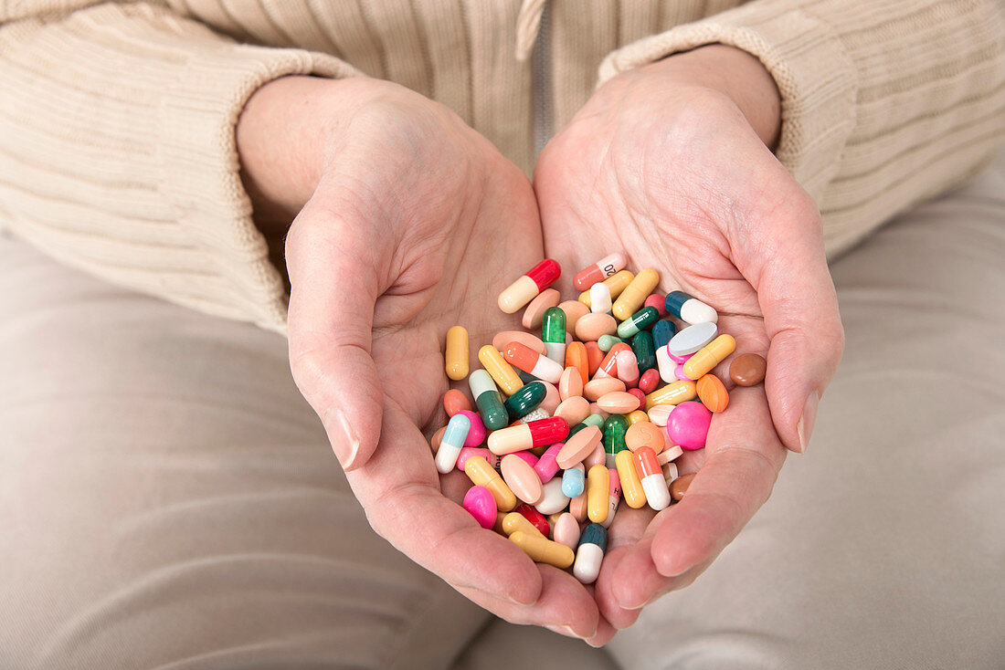 Woman holding pills
