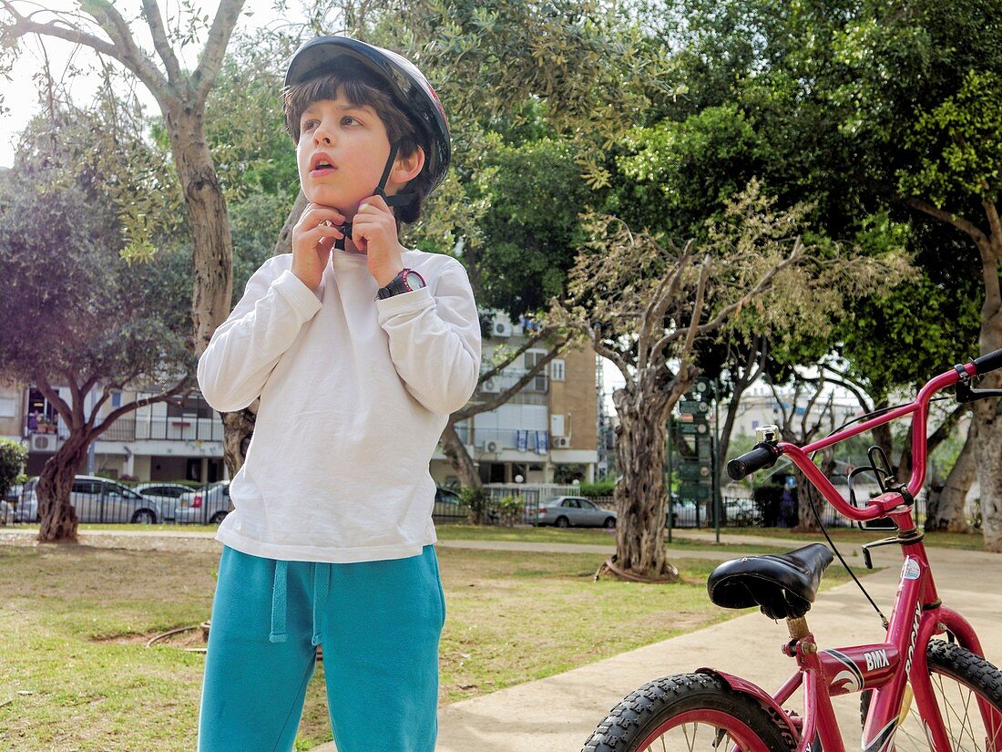 Boy of seven rides a bicycle