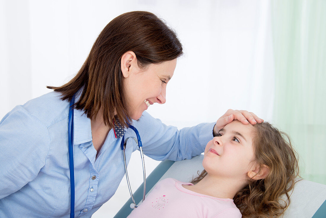 Doctor caring for girl