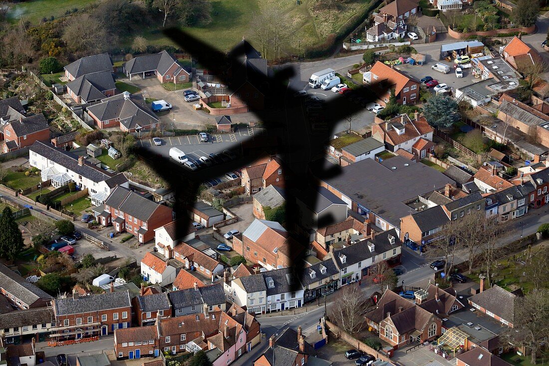 Aeroplane shadow over houses