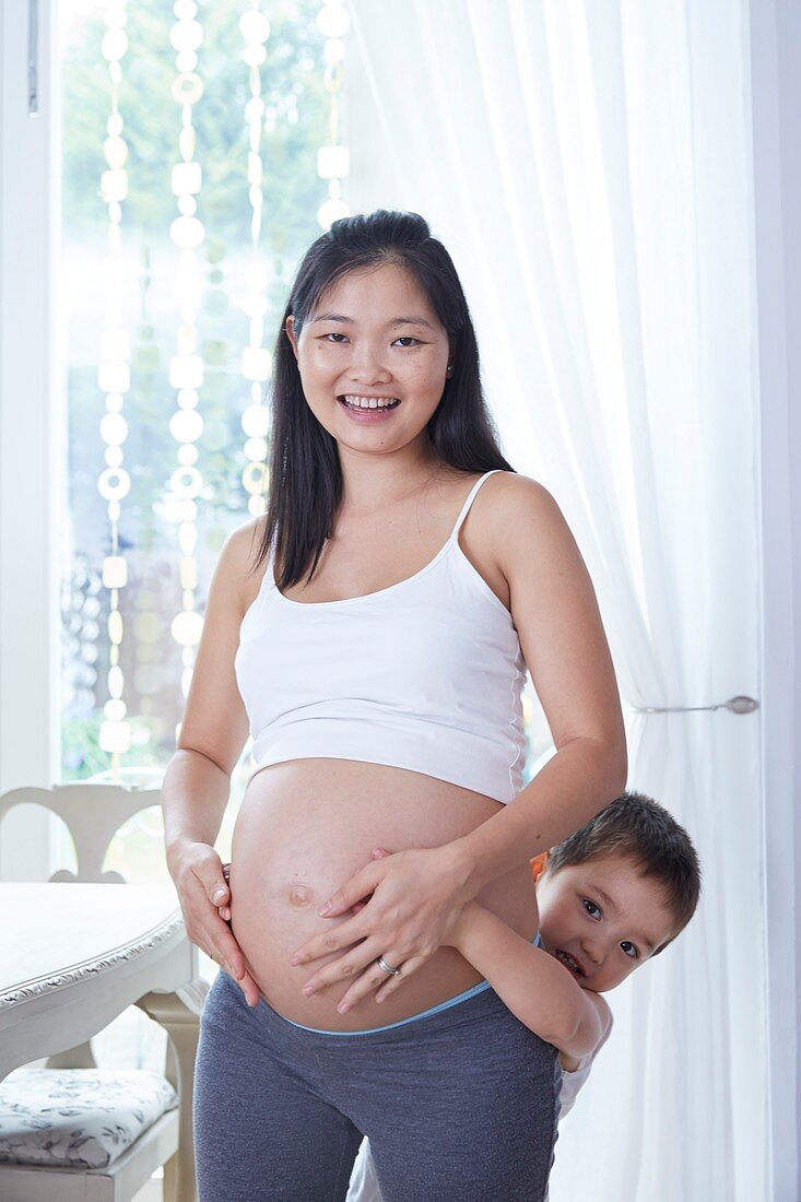Pregnant woman with son