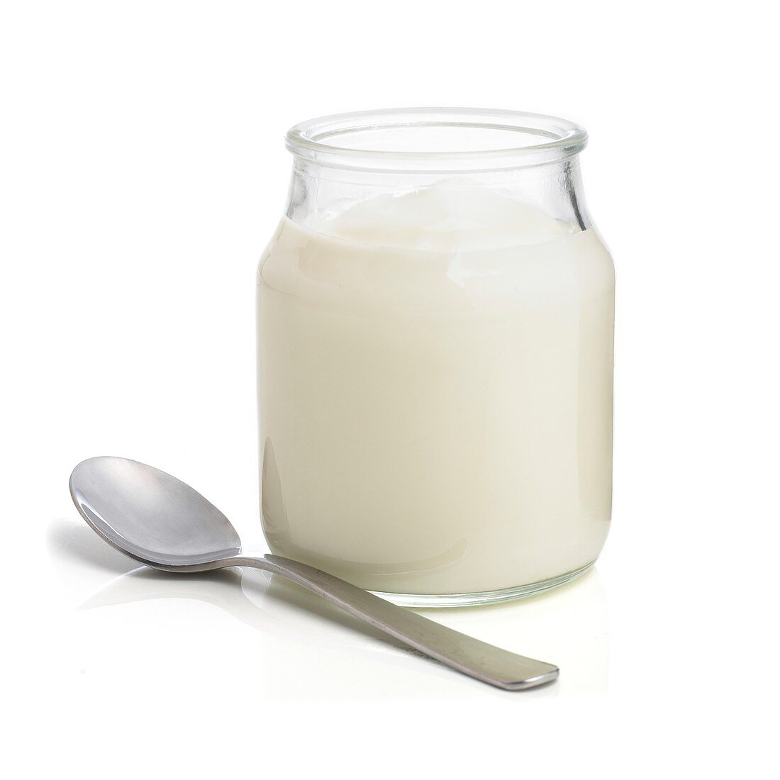 Jar of natural yoghurt and a spoon