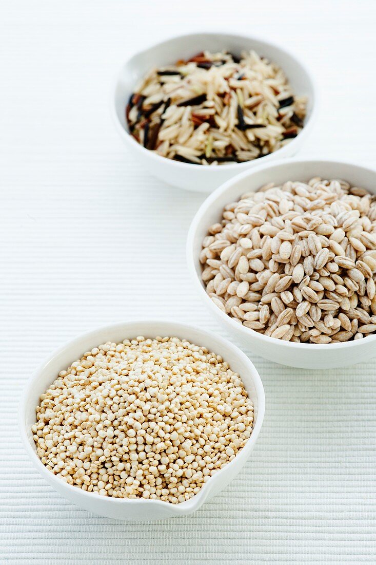 Barley,rice and quinoa in bowls