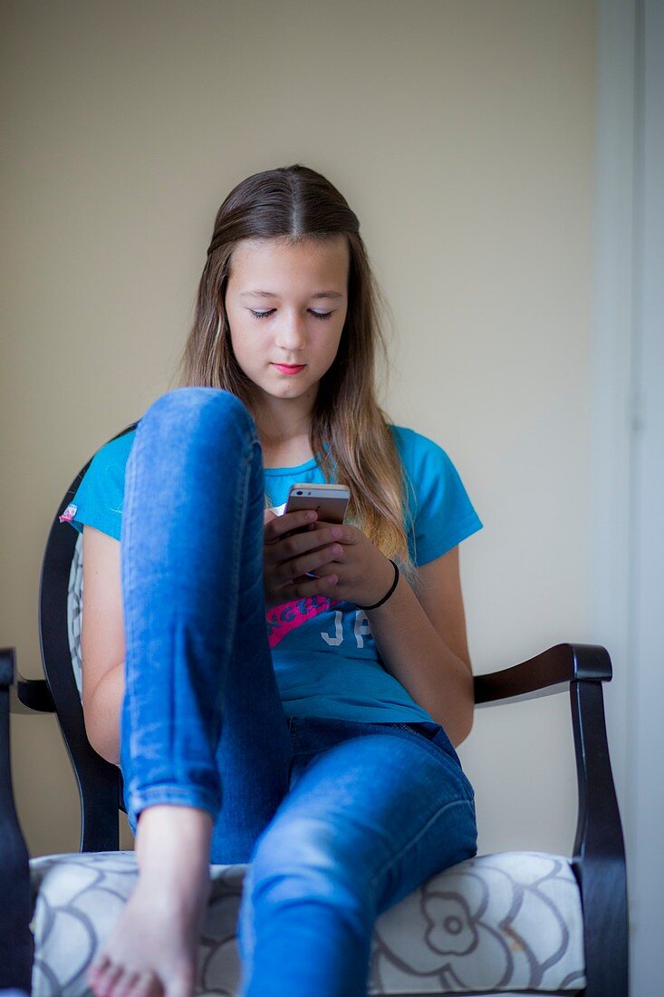 Teenage girl using smartphone