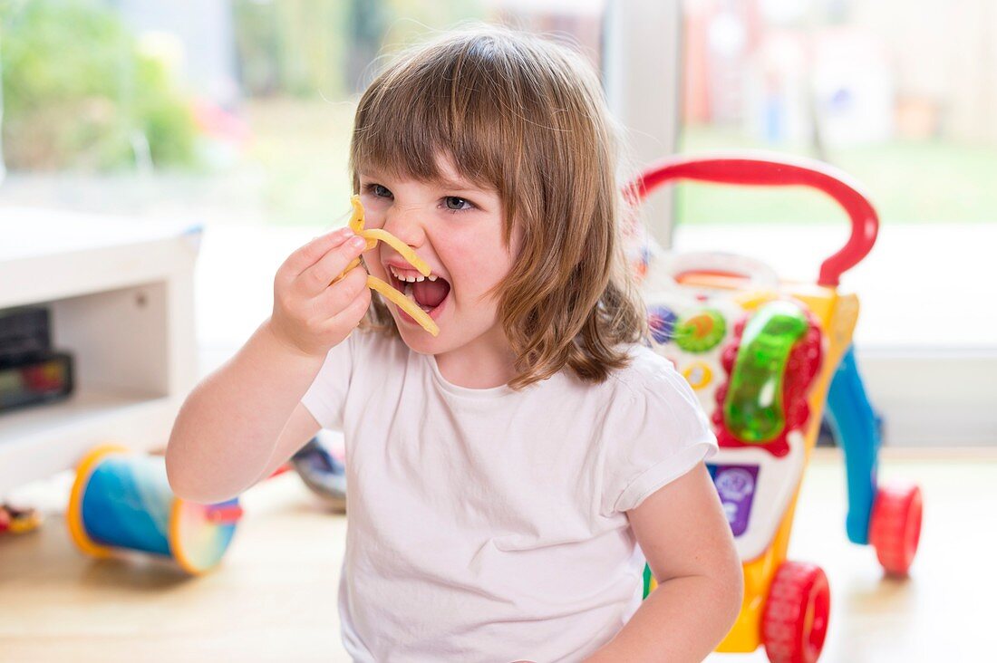 Girl eating french fries